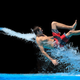 Image for article titled The Absurd Joy Of Waterslides Is Captured In These Perfectly Timed Shots